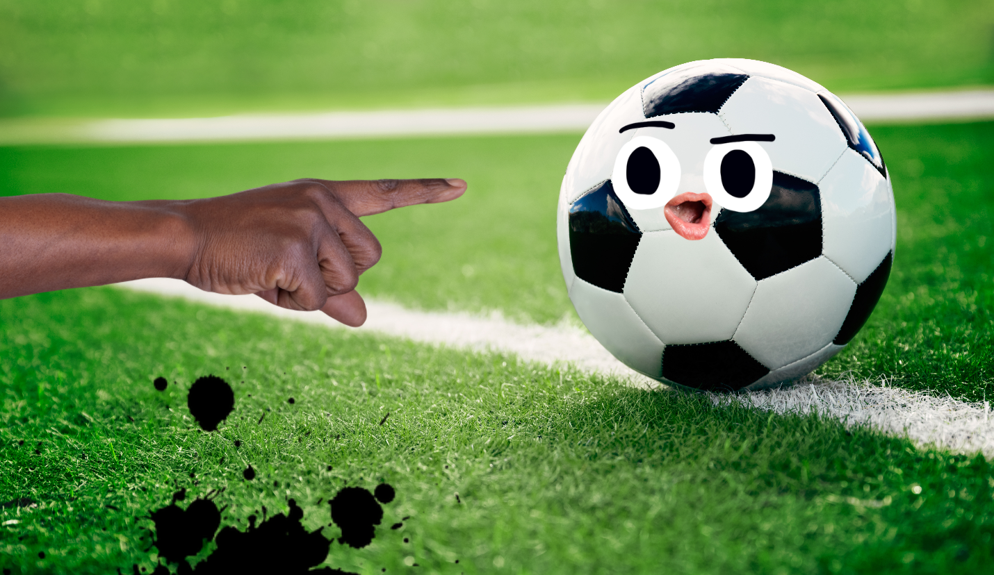 A hand pointing at a football