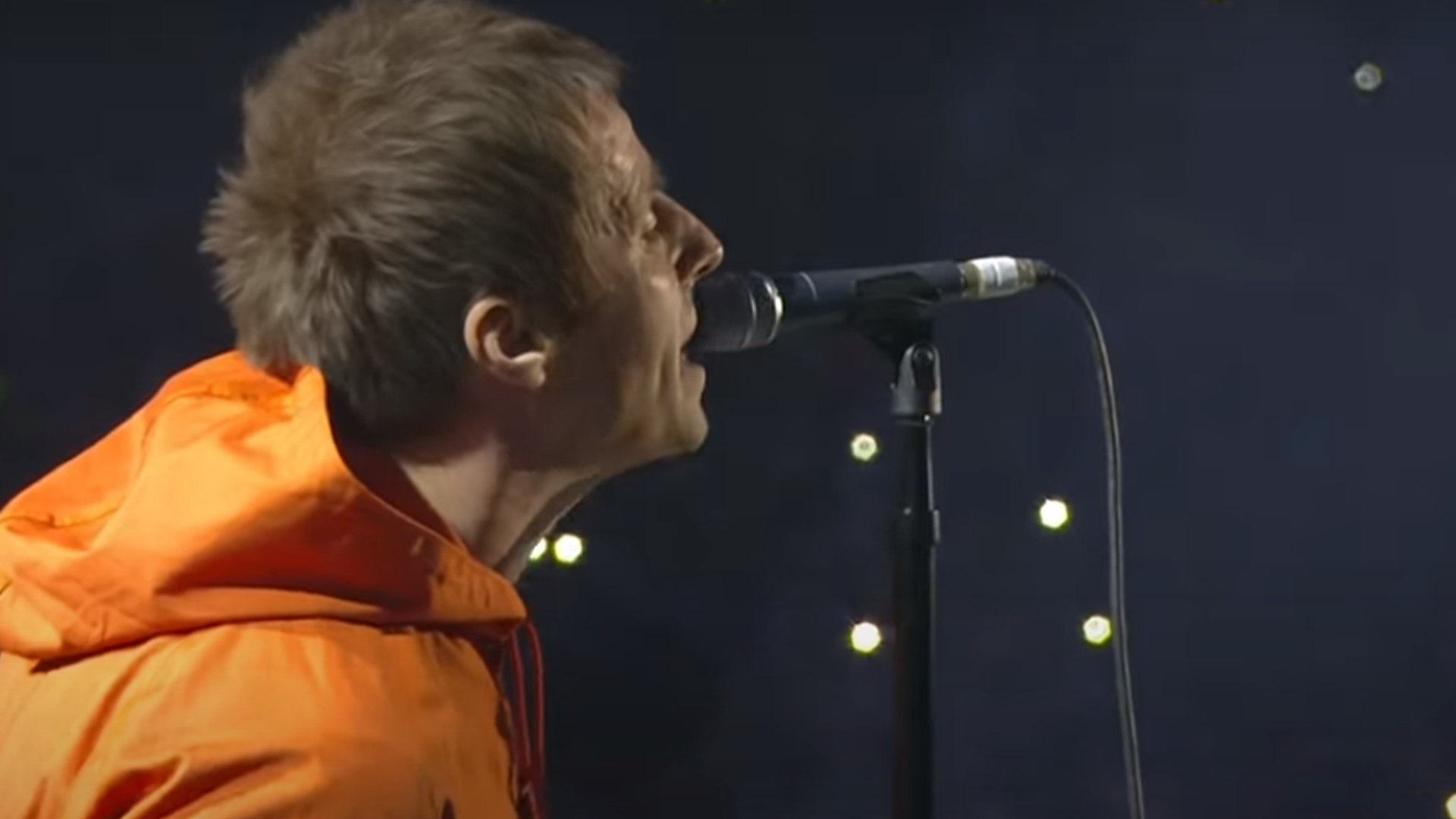 Liam Gallagher singing on stage