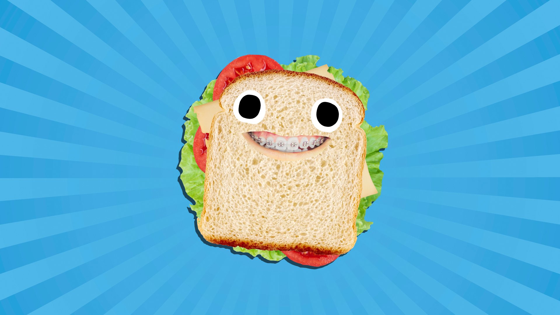 A grinning sandwich with cheese, tomato and lettuce inside