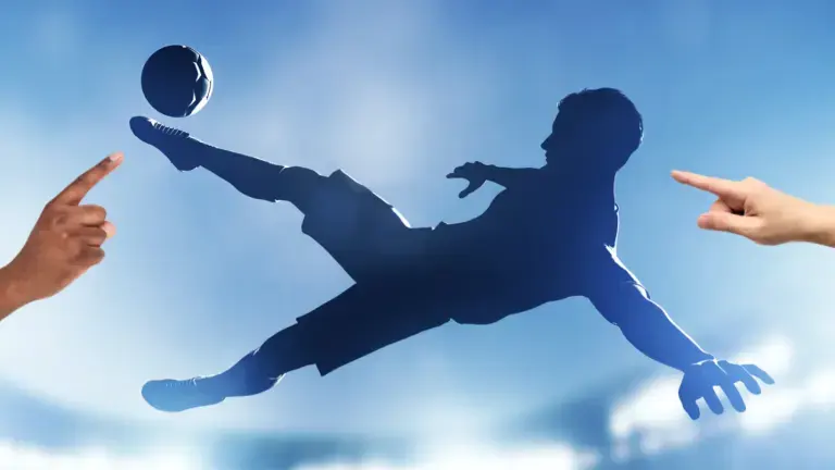 A silhouette of a footballer