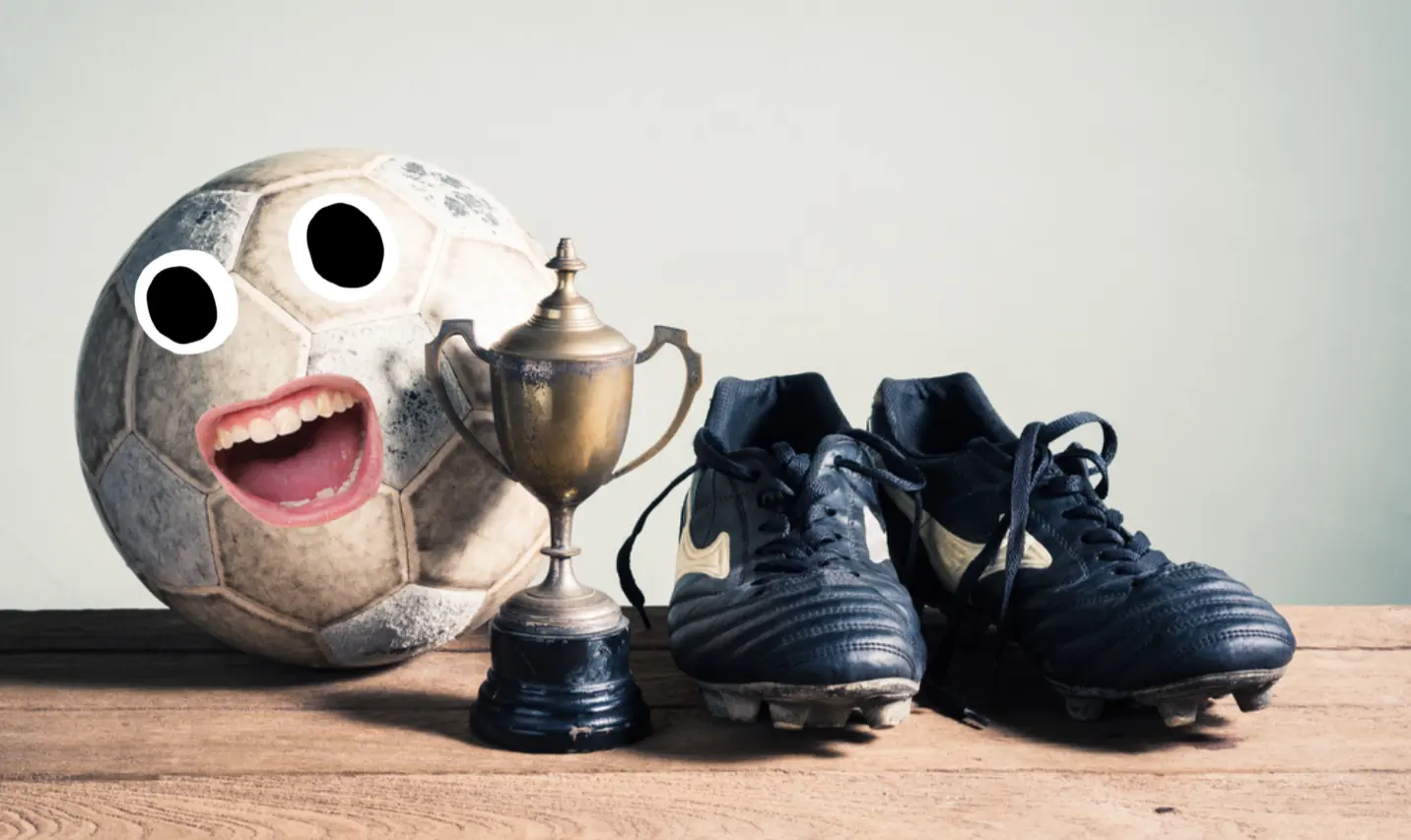 A football trophy and boots