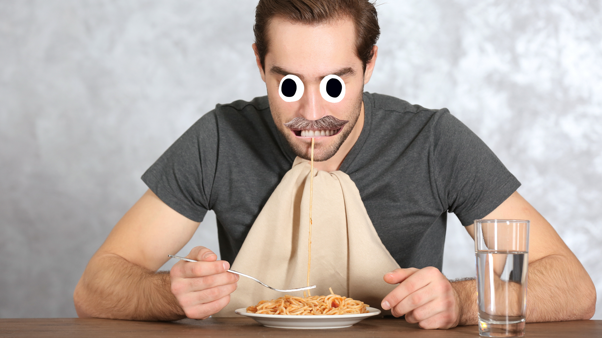 A man eating spaghetti bolognese