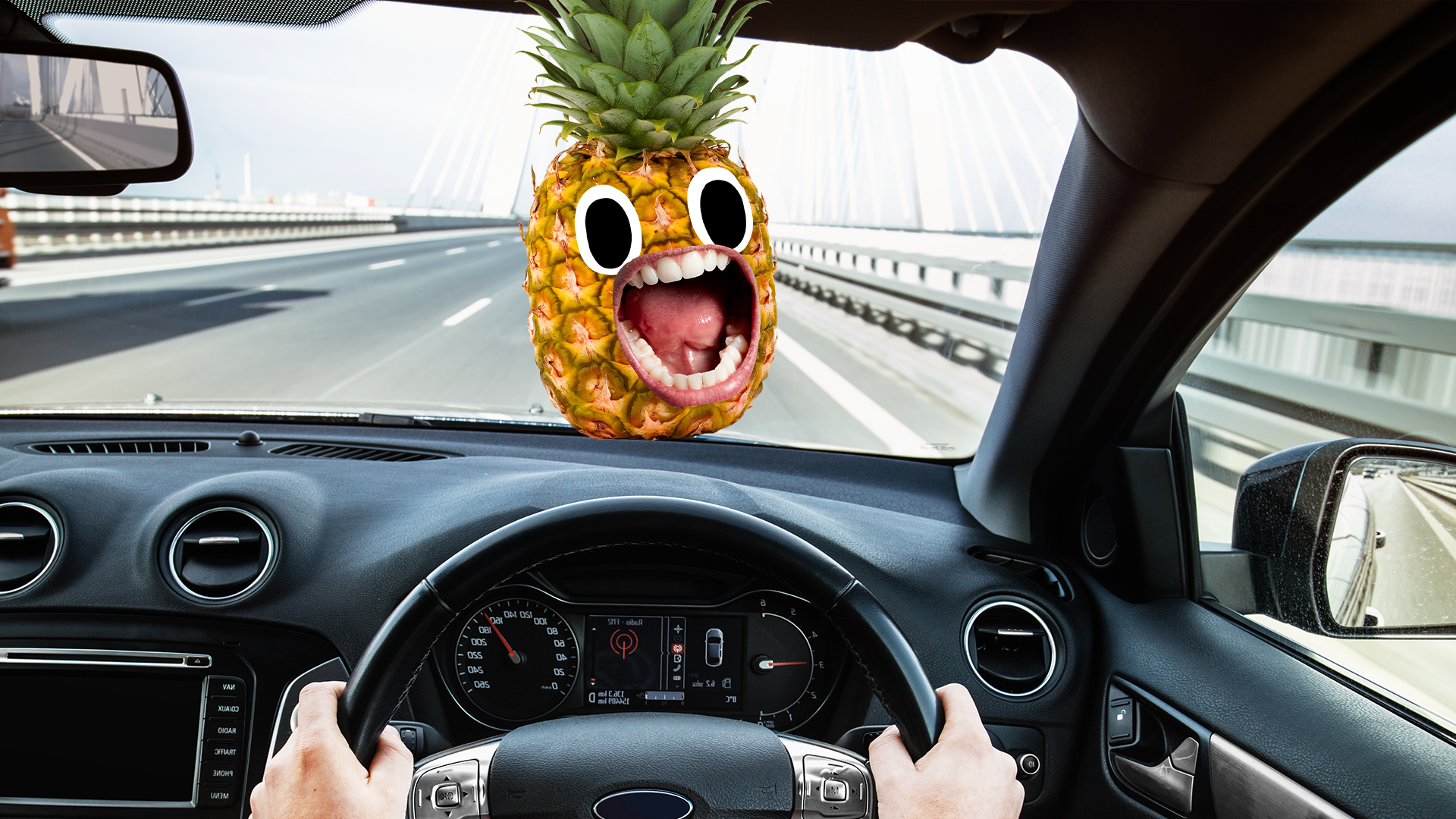 Someone driving with screaming pineapple