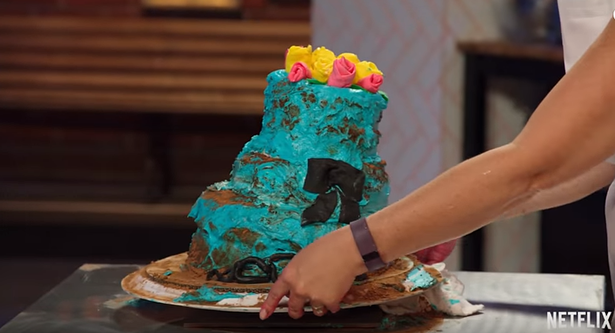 A messy blue cake