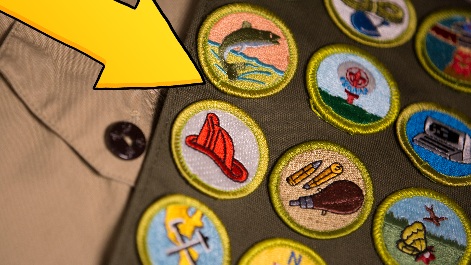 Yellow arrow pointing to Scout badges