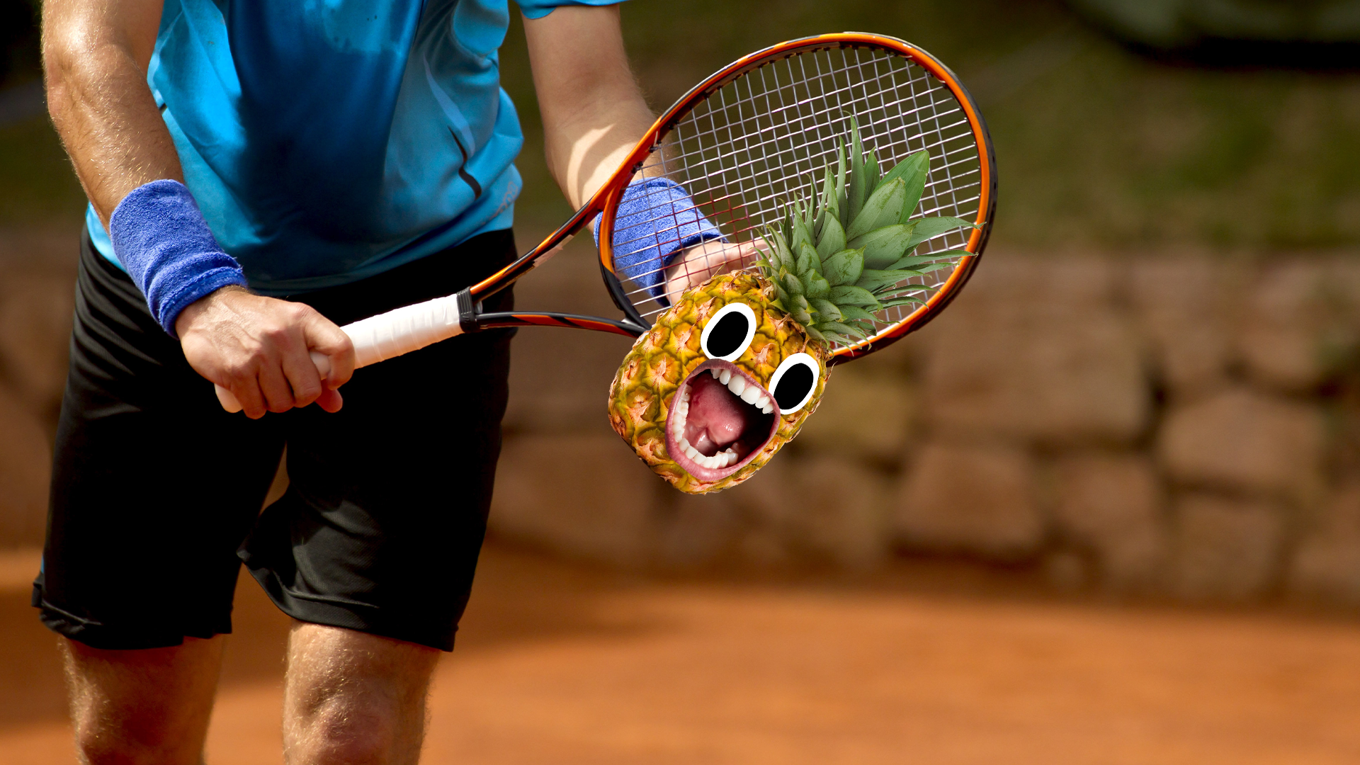 Man playing tennis with pineapple