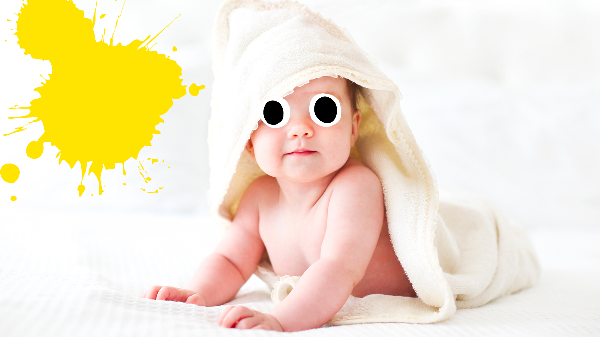 Baby on bed with yellow splat 
