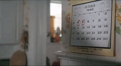 A woman looks at her calendar