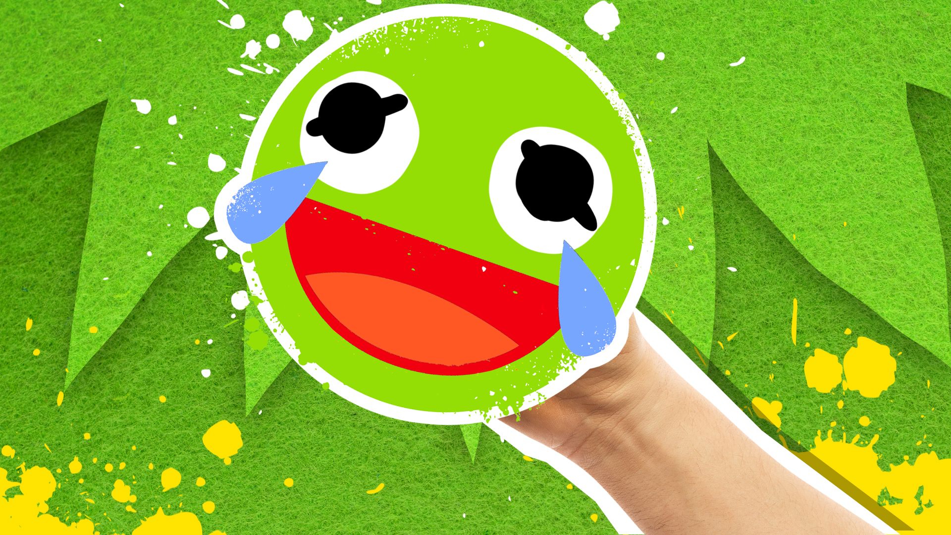 A laughing green faced emoji