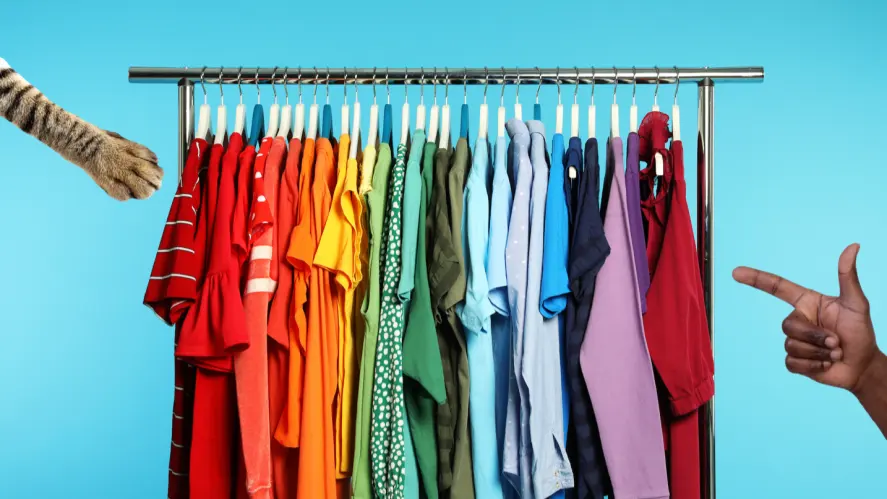 A clothes rack full of colourful t-shirts