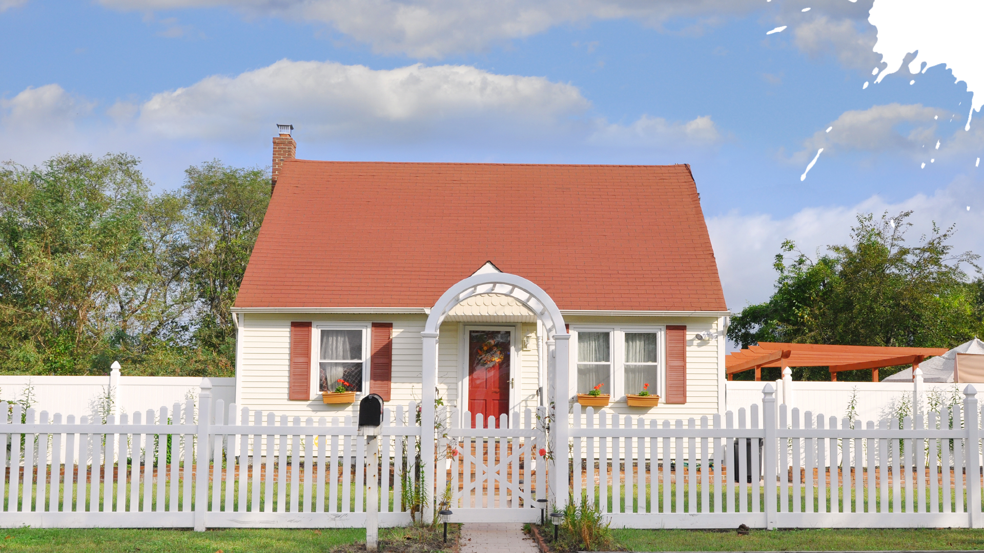 Picturesque suburban house with white picket fence
