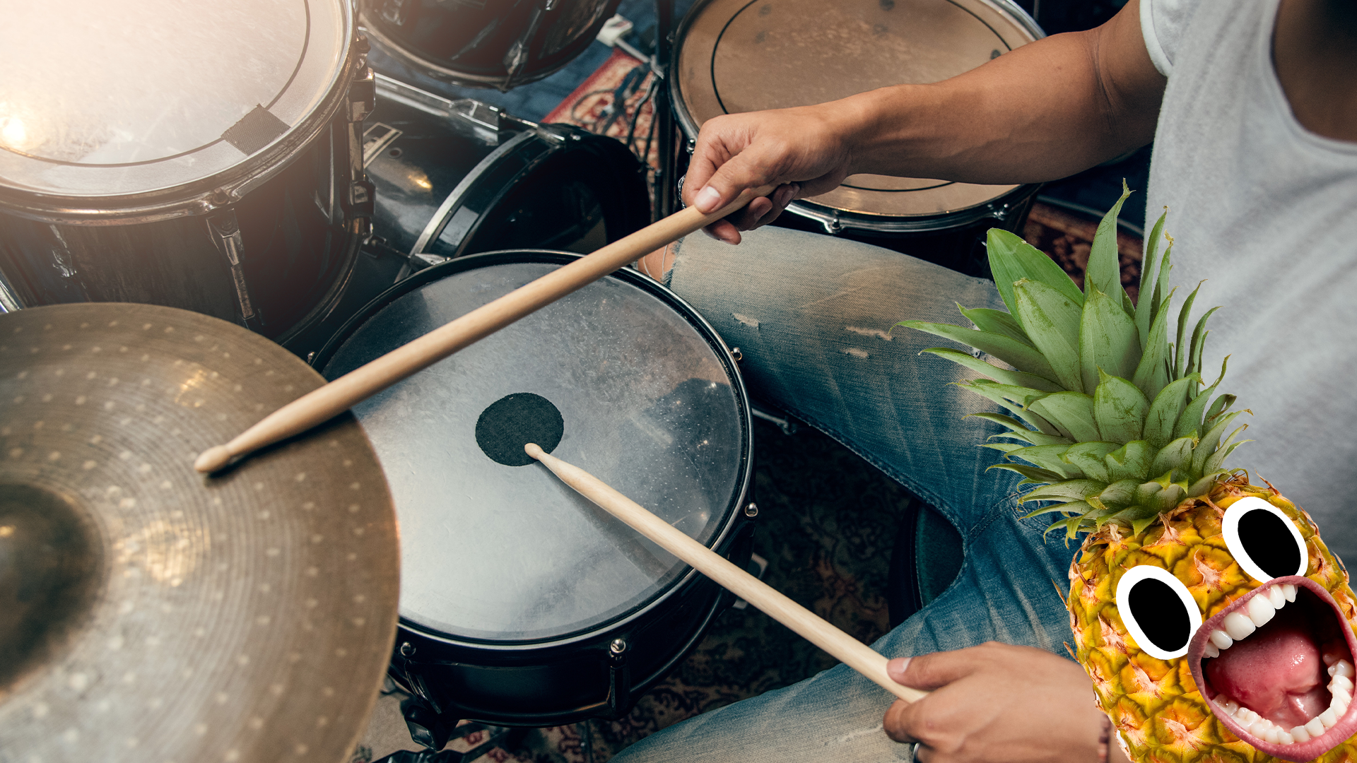 Drummer and drumkit with screaming pineapple