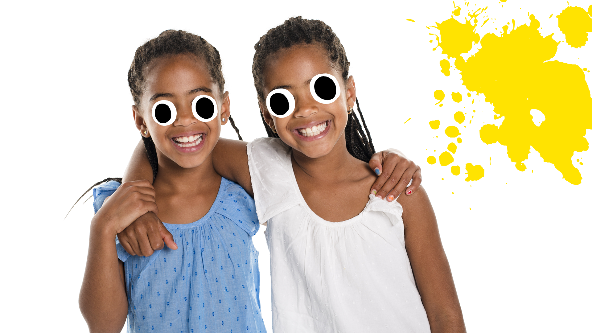 Smiling female twins with yellow splat