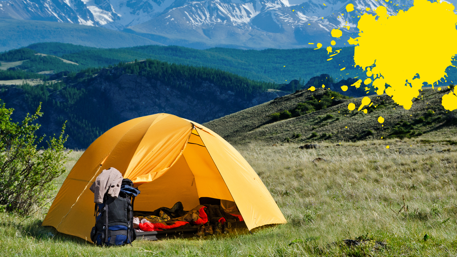 Tent on hillside with yellow splat