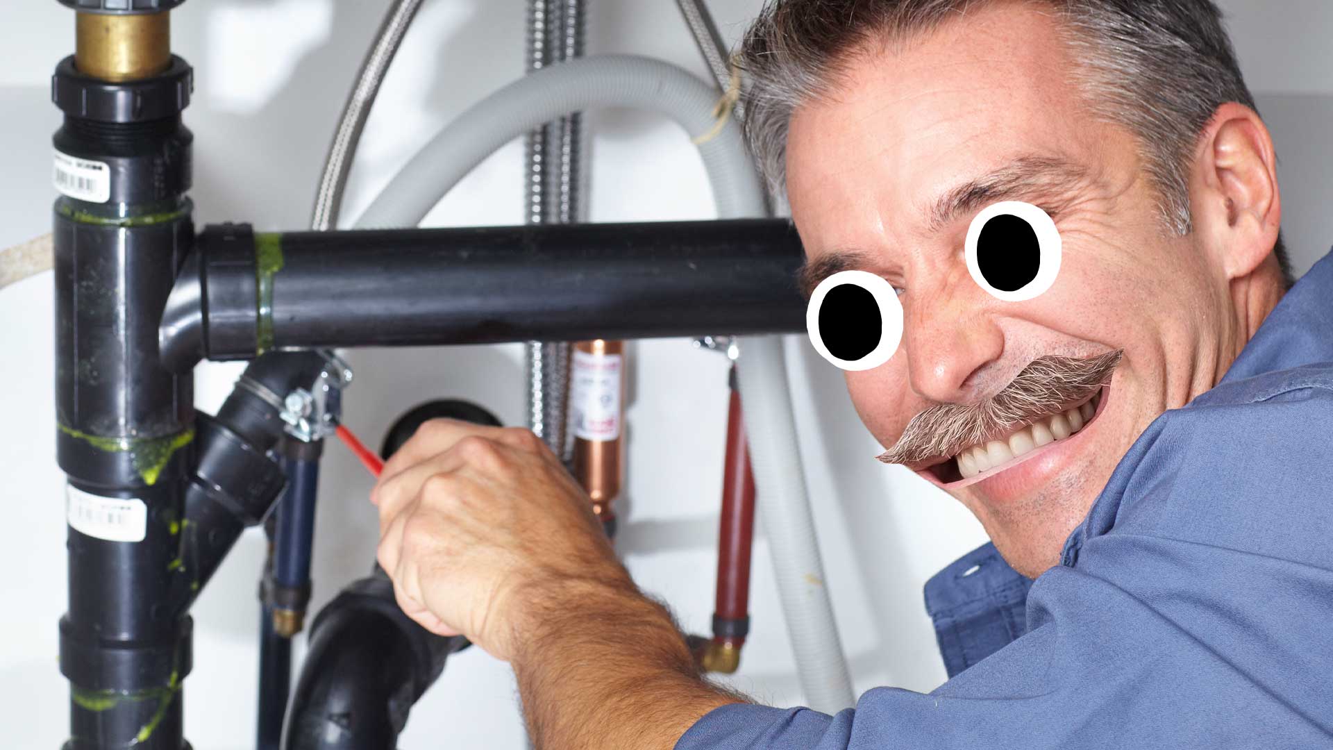 A plumber under a sink