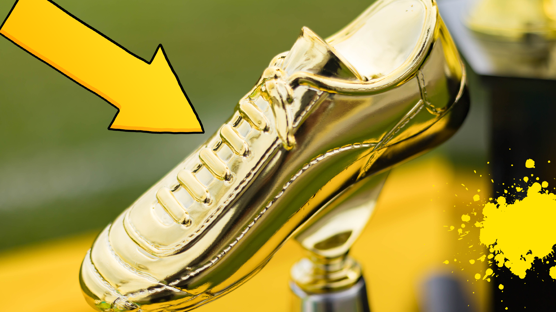 Golden football boot with arrow and yellow splat