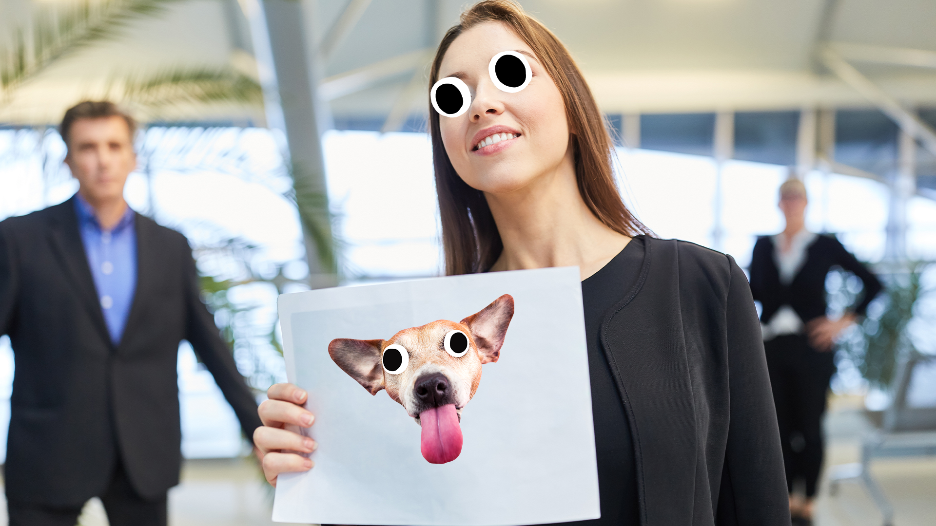Woman holding up sign with derpy dog face on it