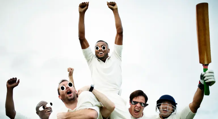 A cricket team celebrating 