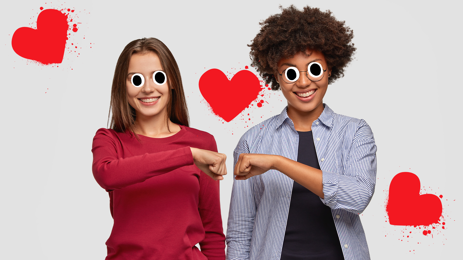 Two female friends bumping fists on white background with splat hearts