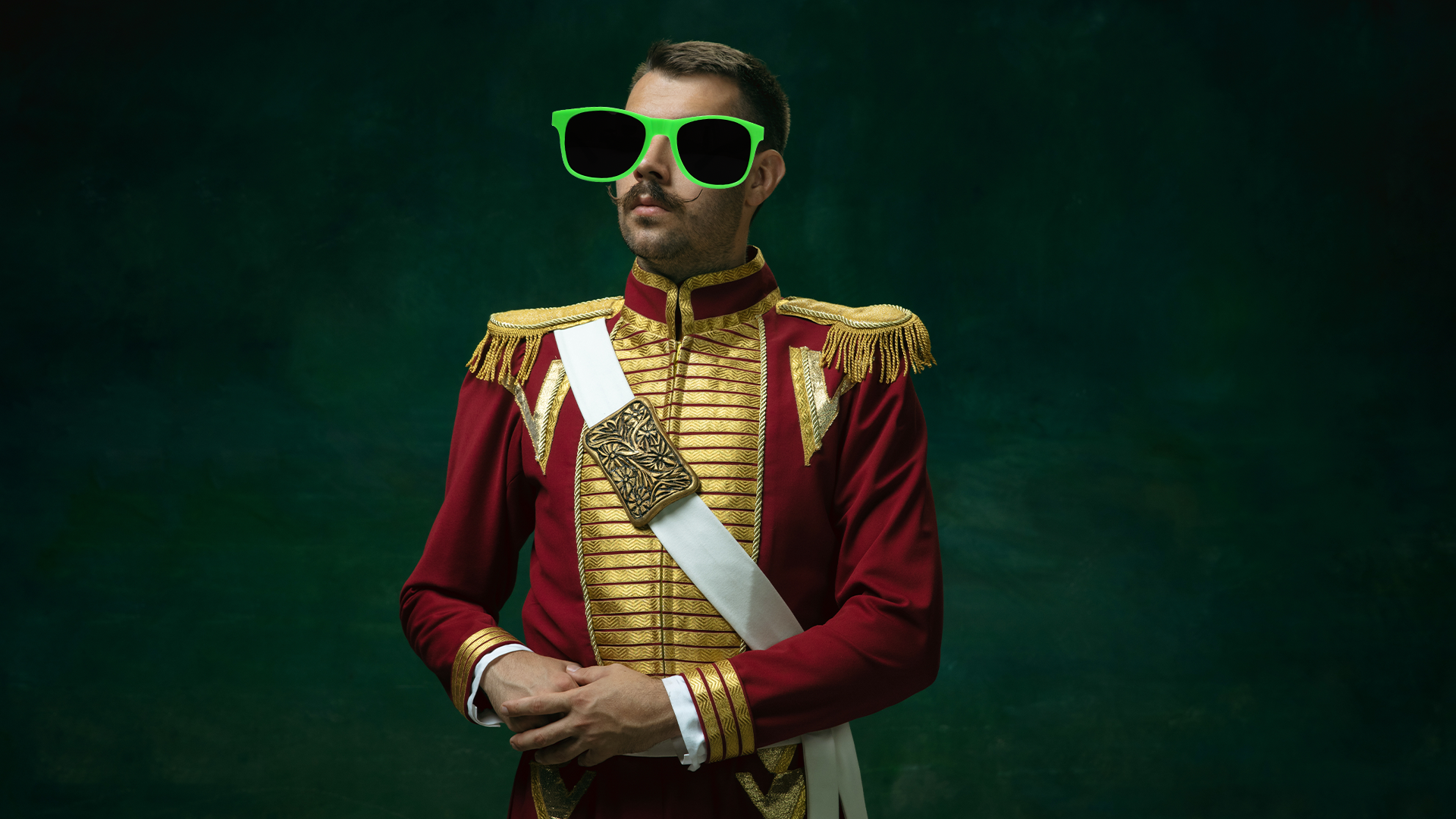 Royal man in sunglasses on dark background