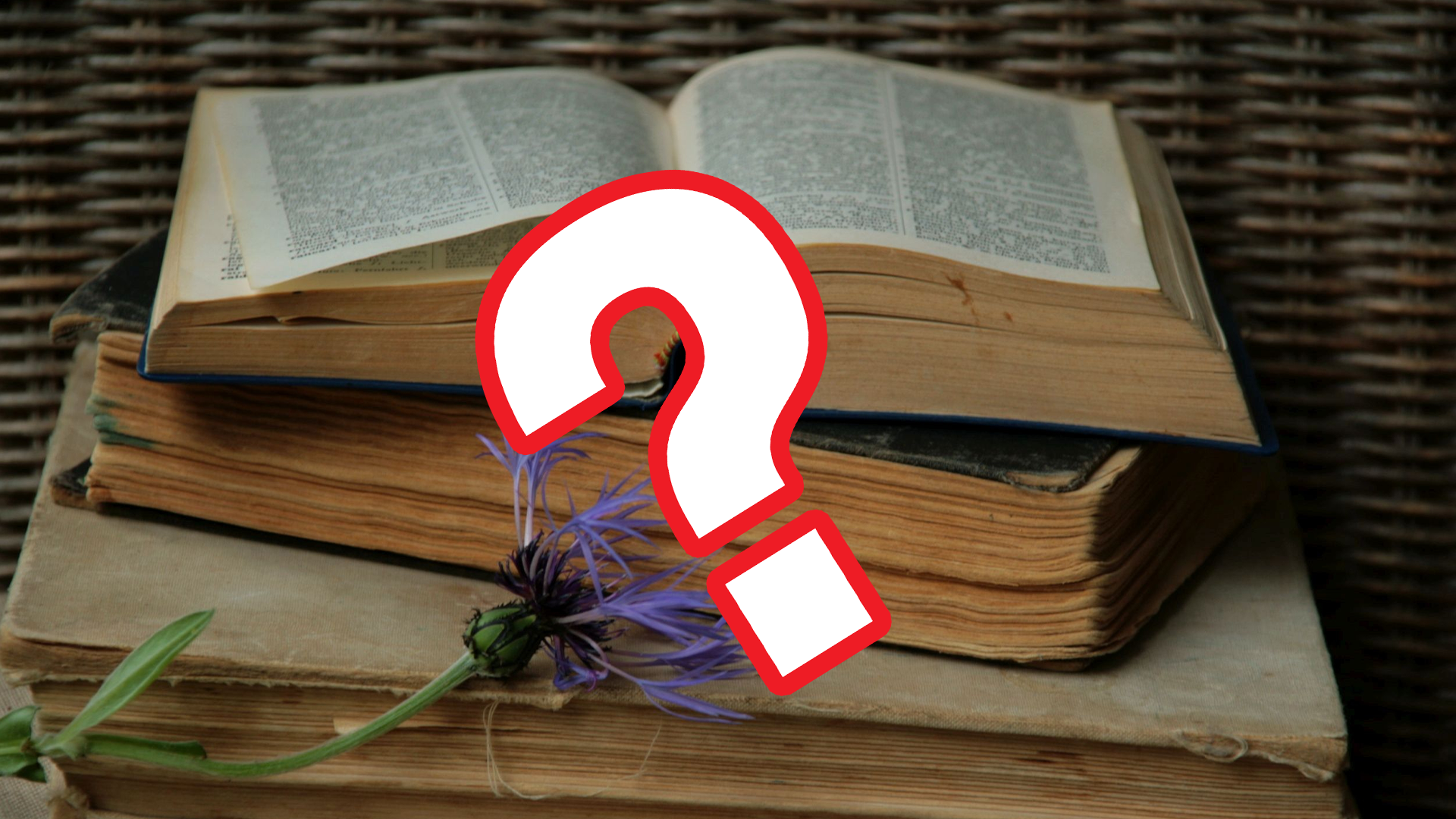 Old books and flowers with question mark