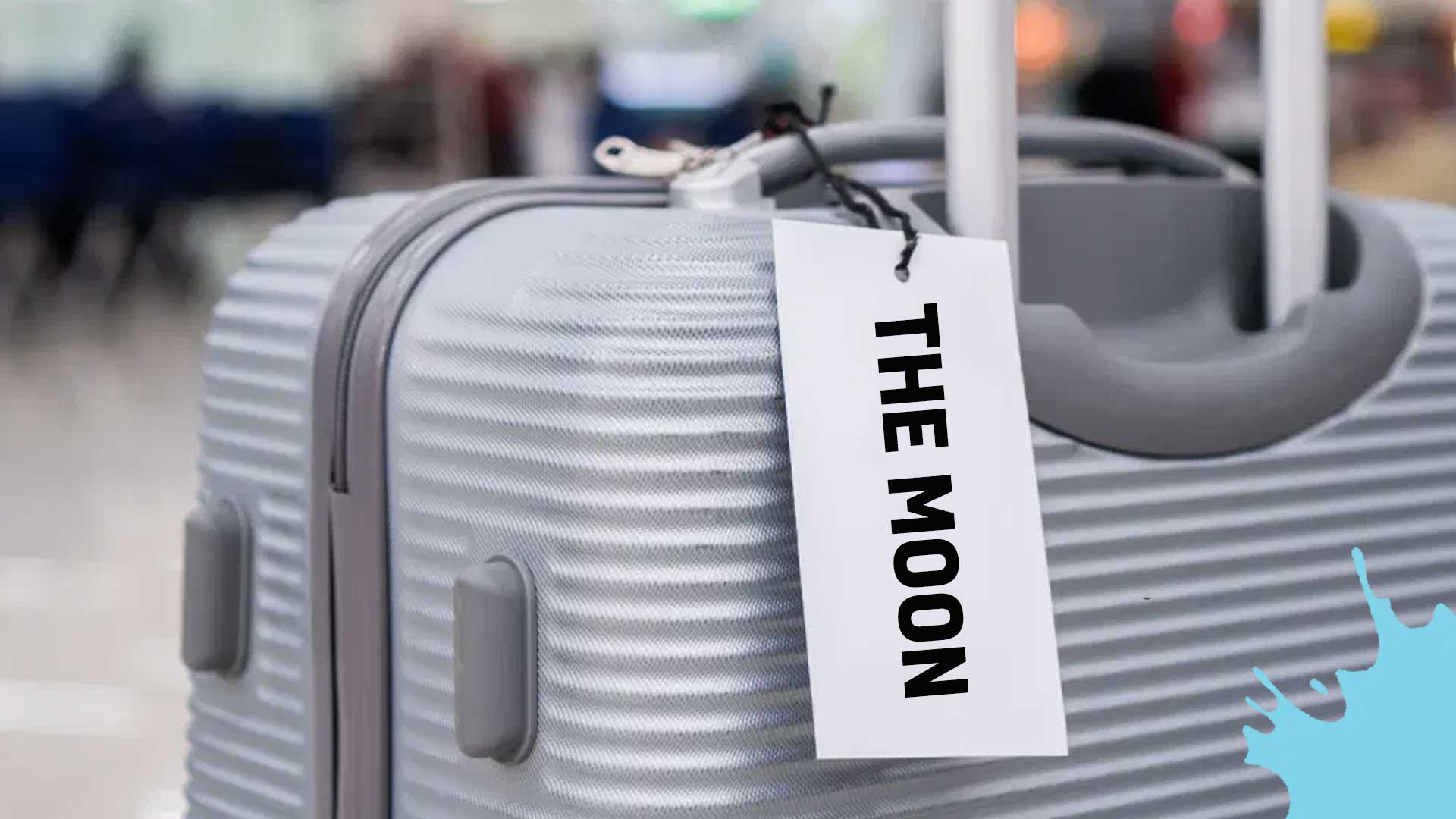 A suitcase with a tag which reads 'The Moon'