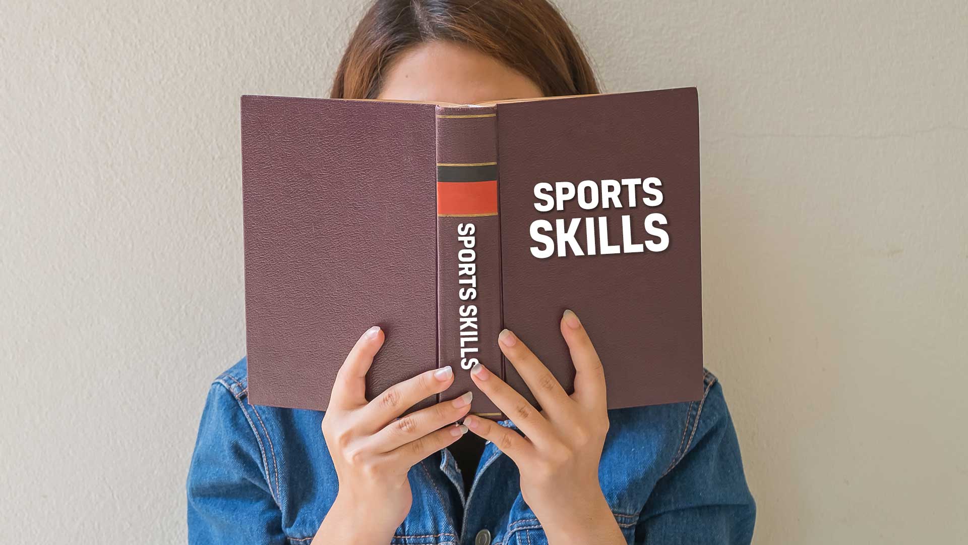 A woman reading a sports book