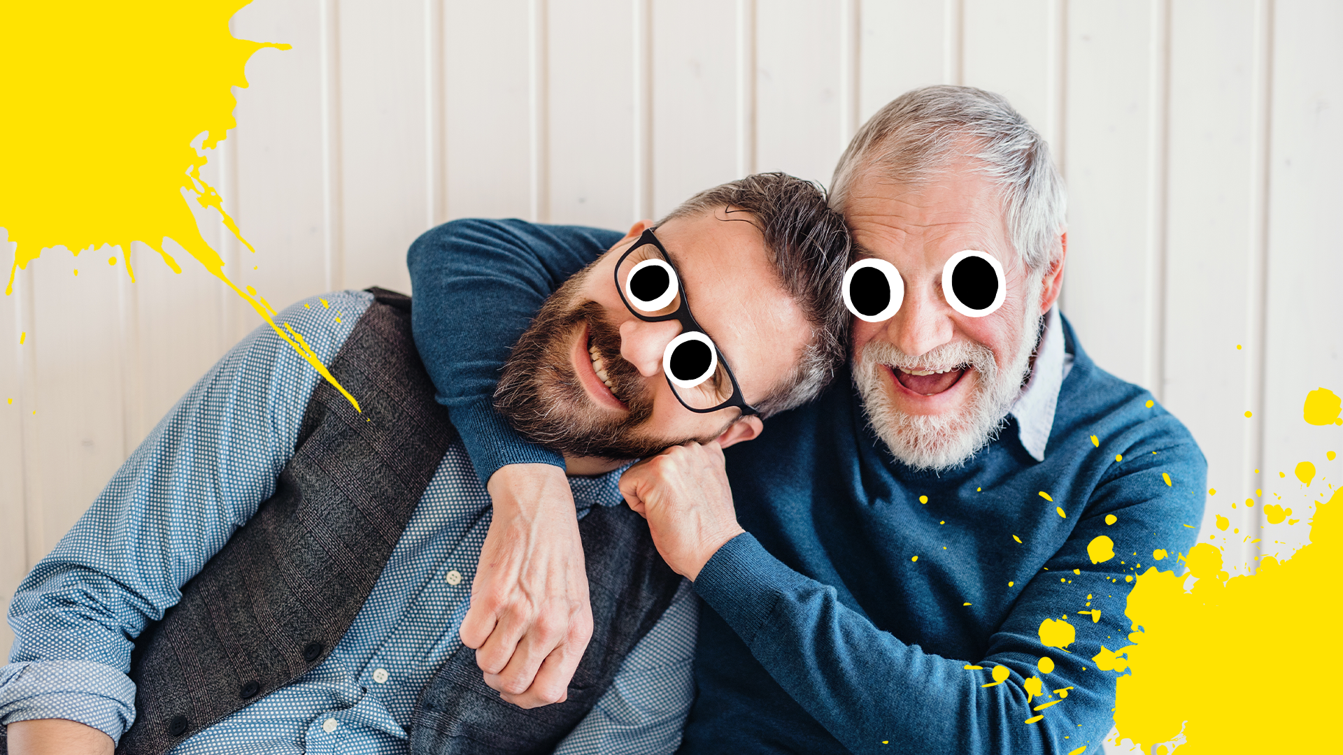 A dad gives his adult son a playful headlock