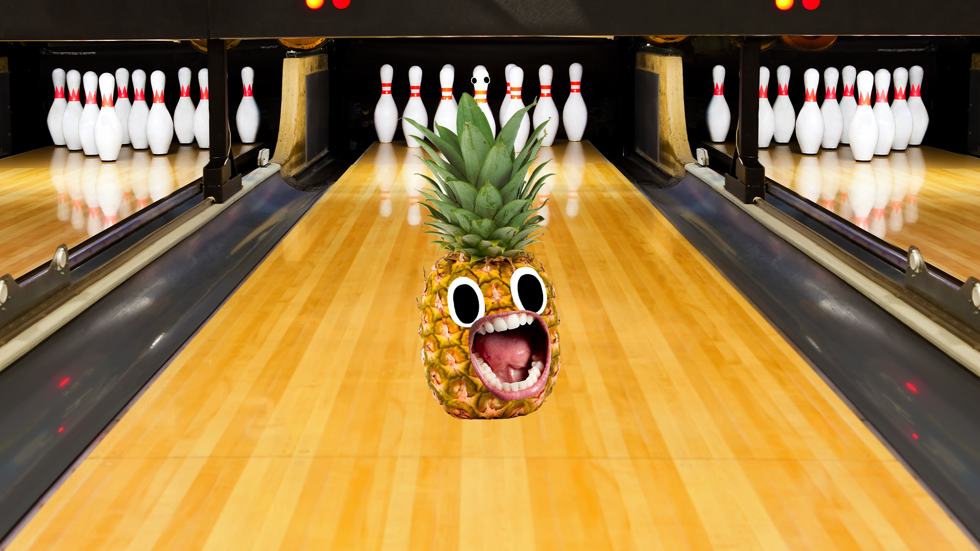 A pineapple in a bowling alley