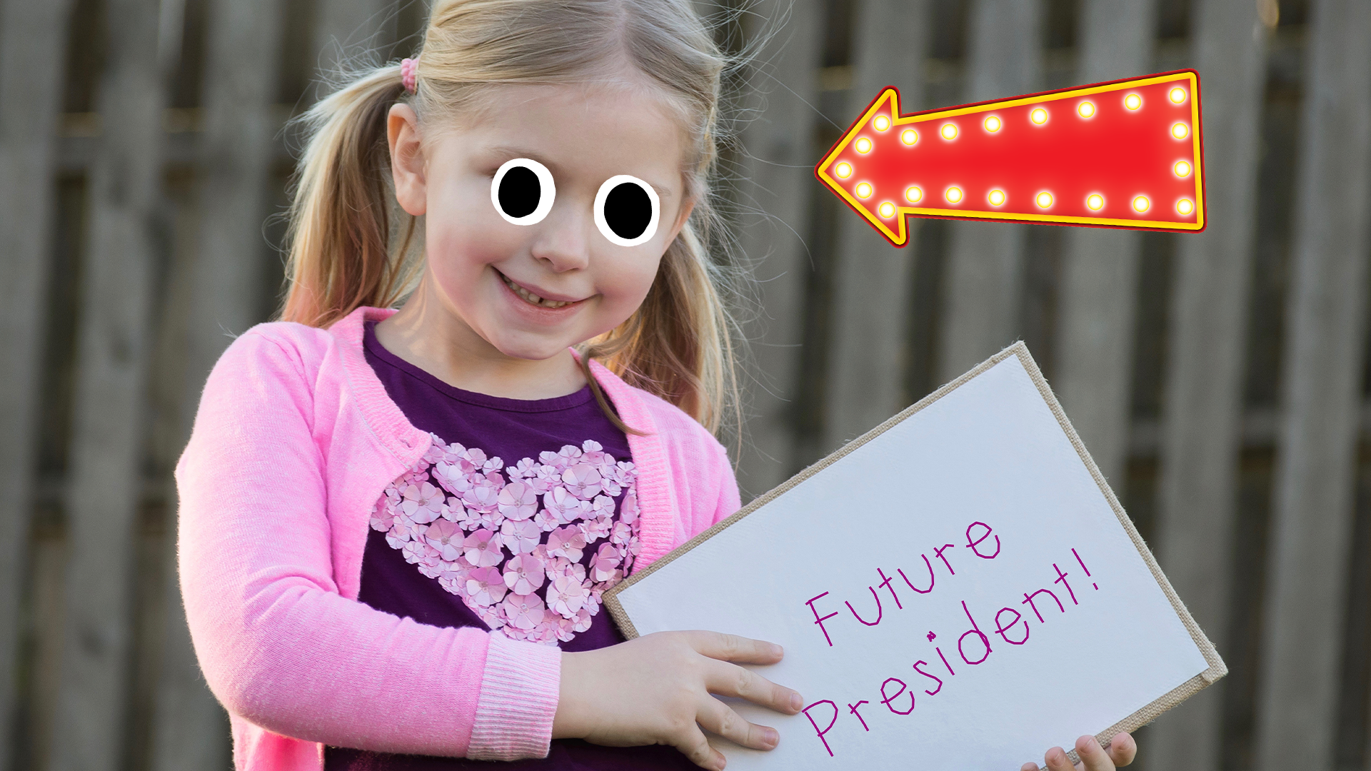 A young girl holding a sign saying 'Future President' 