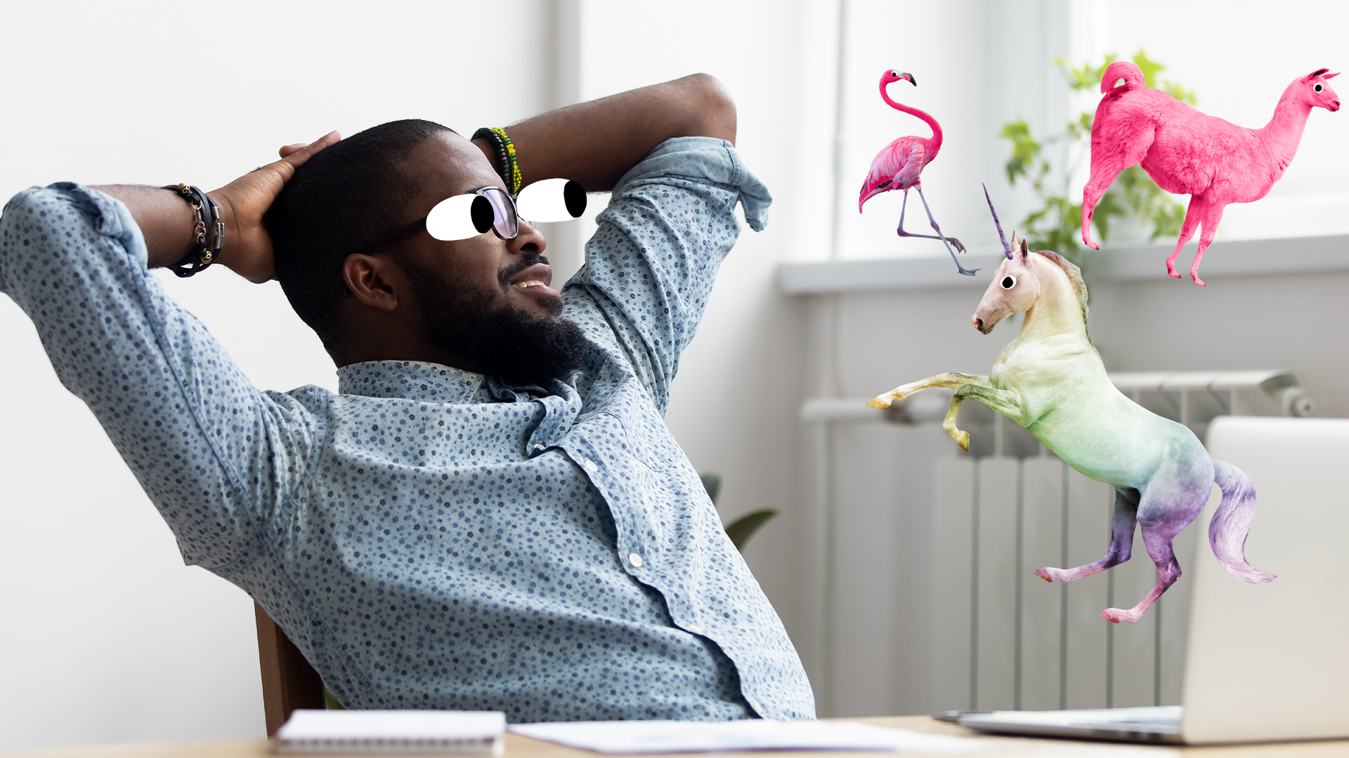 A man relaxes while surrounded by a unicorn, llama and flamingo