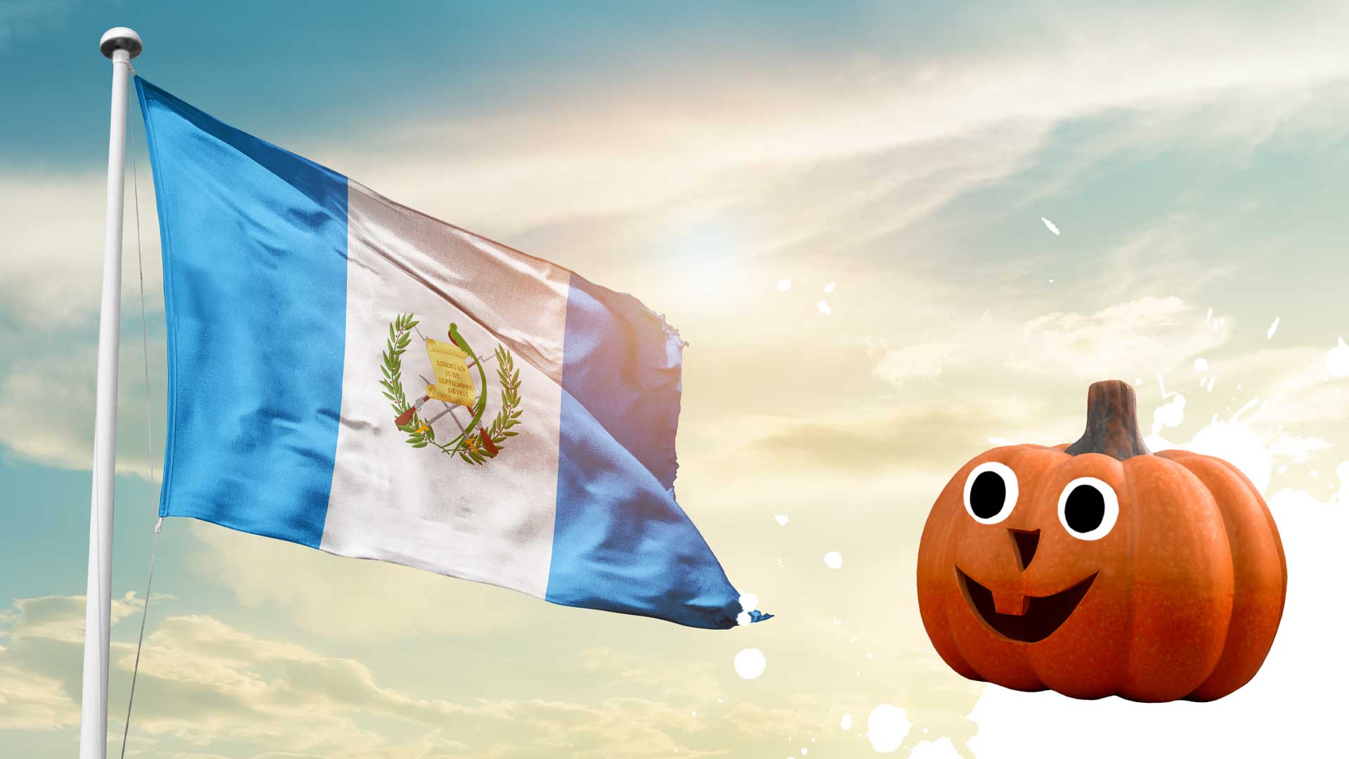 A Guatemalan flag and a happy pumpkin