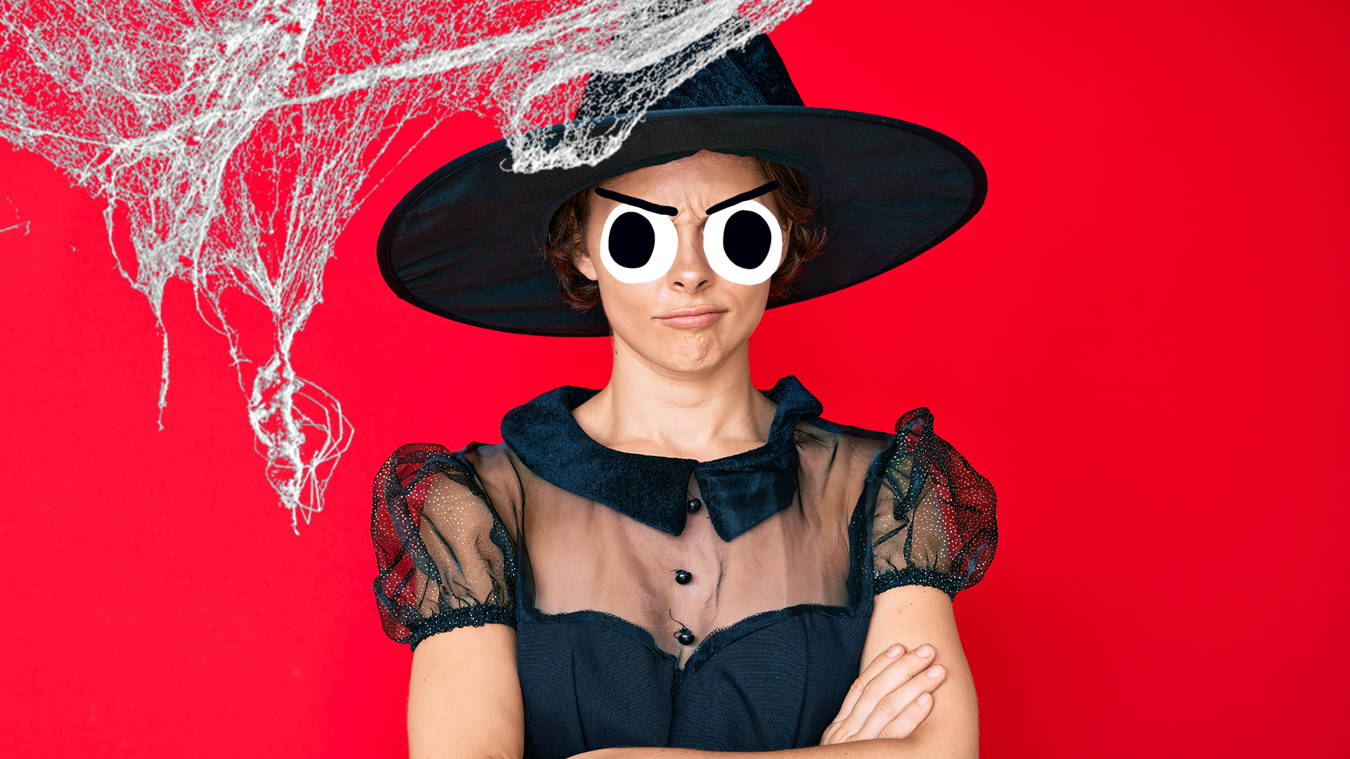 Grumpy looking witch on red background with cobwebs
