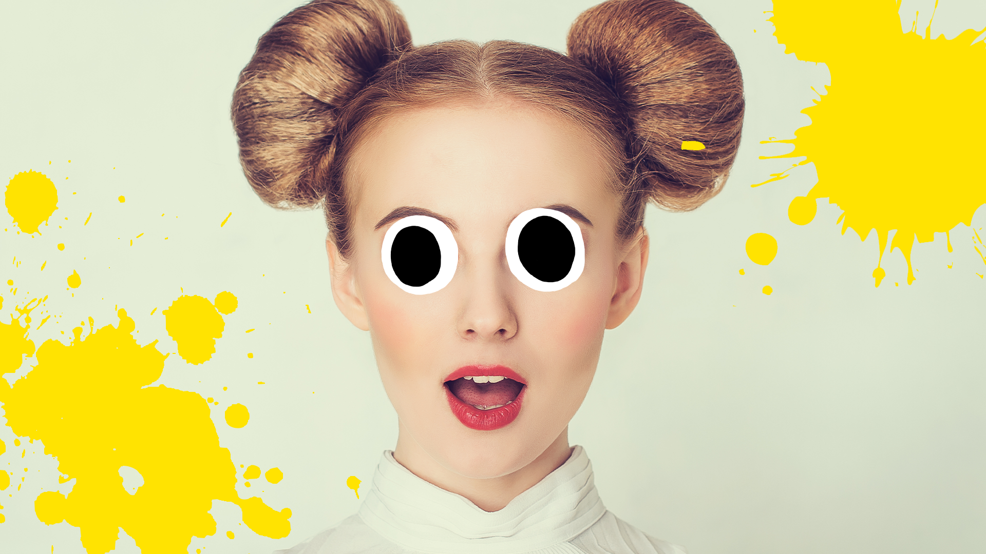 Woman with hair in buns on grey background with yellow splats