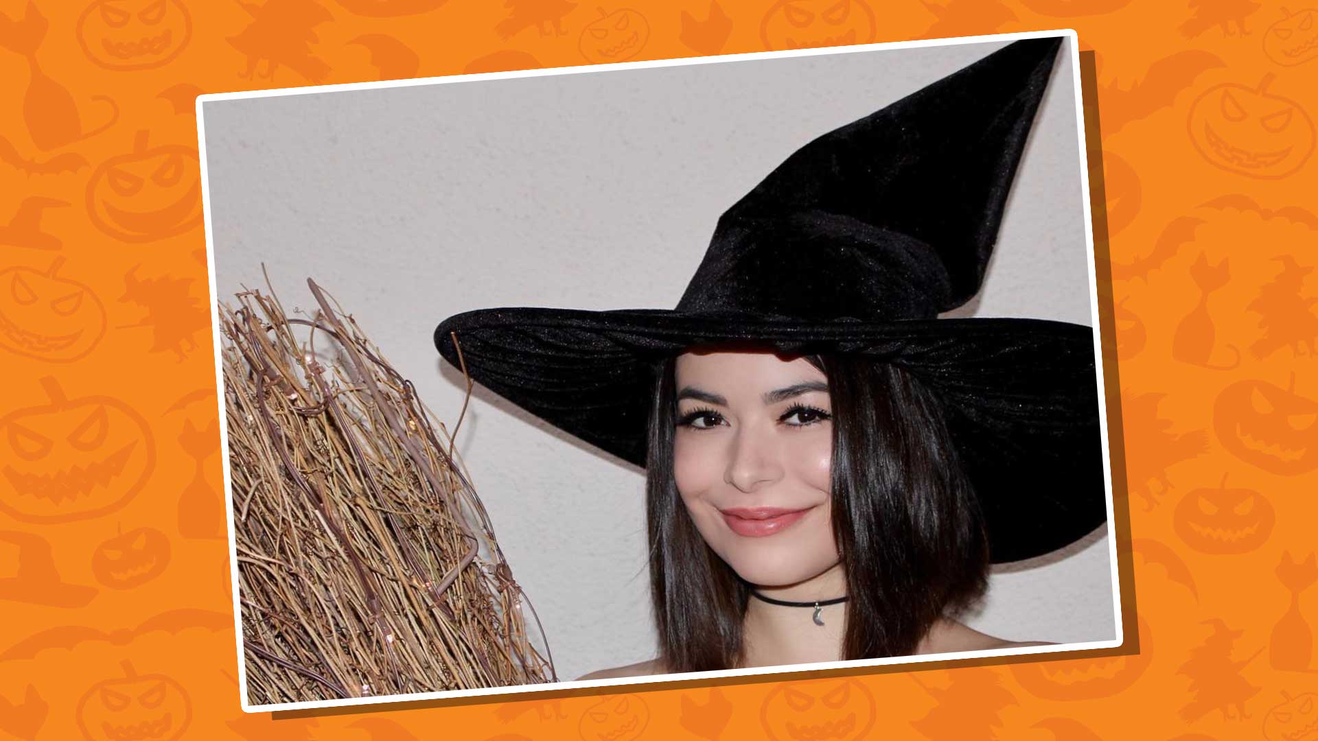 Miranda Cosgrove dressed as a witch with a broom