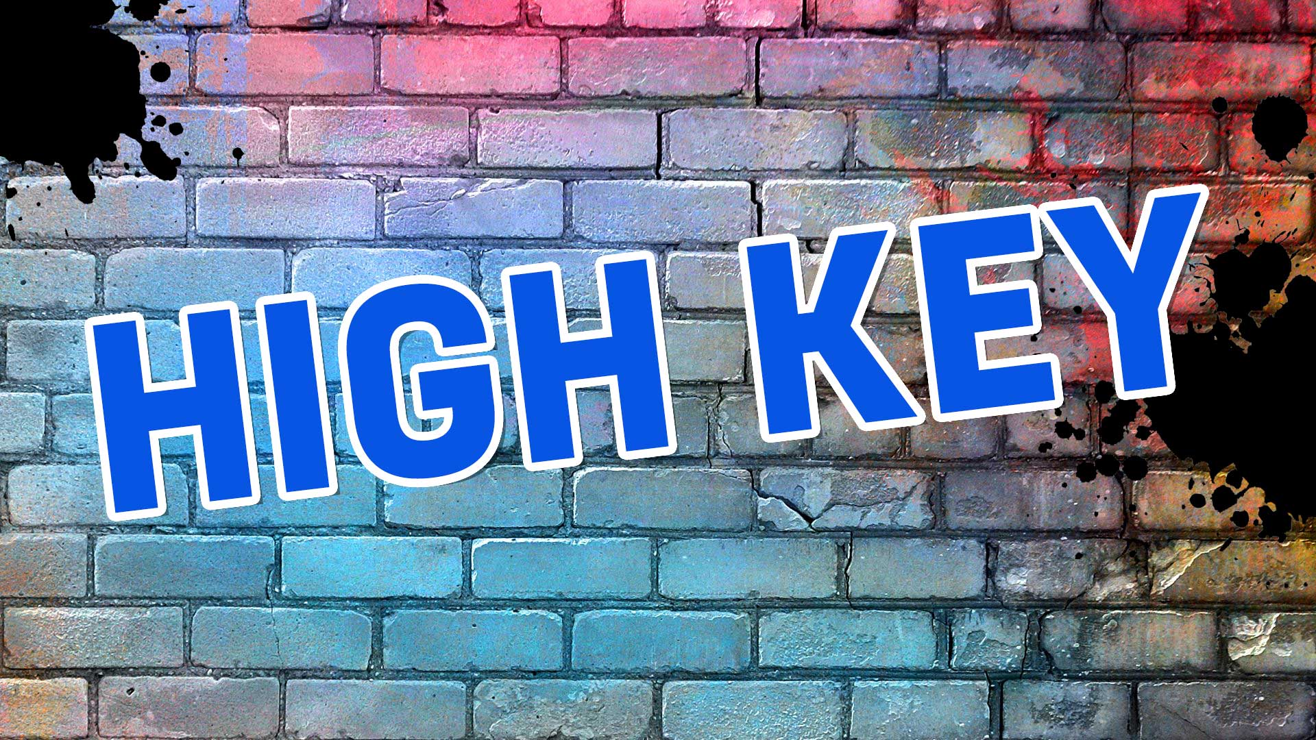 The words high key on a brick background
