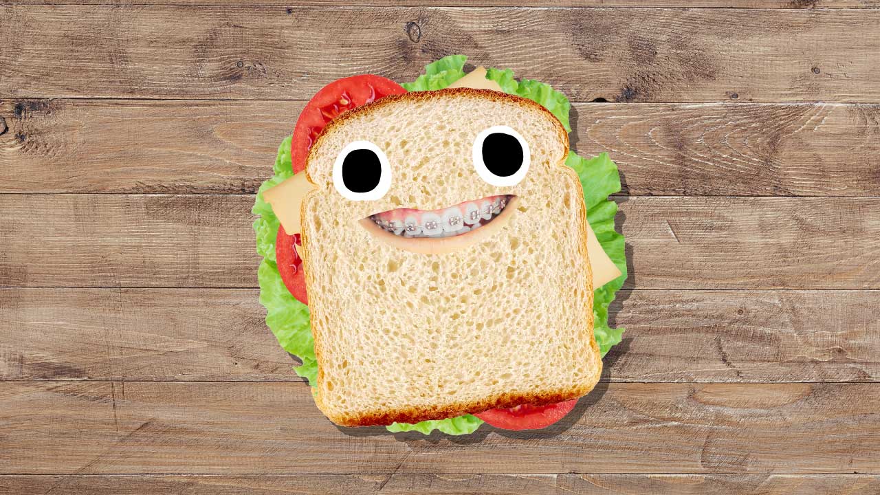 A sandwich on a wooden floor