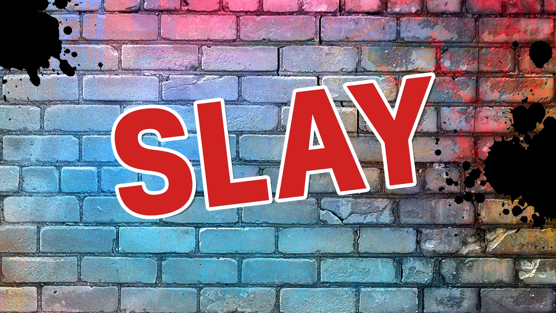 The word slay on a brick background