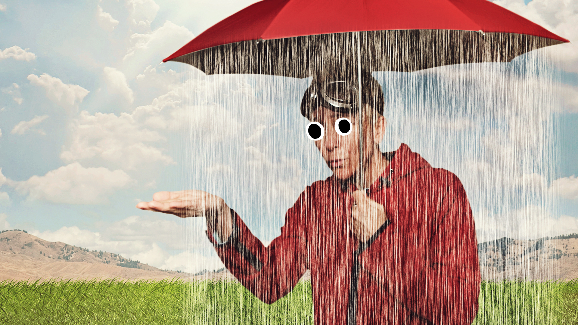 A person under a rainy umbrella