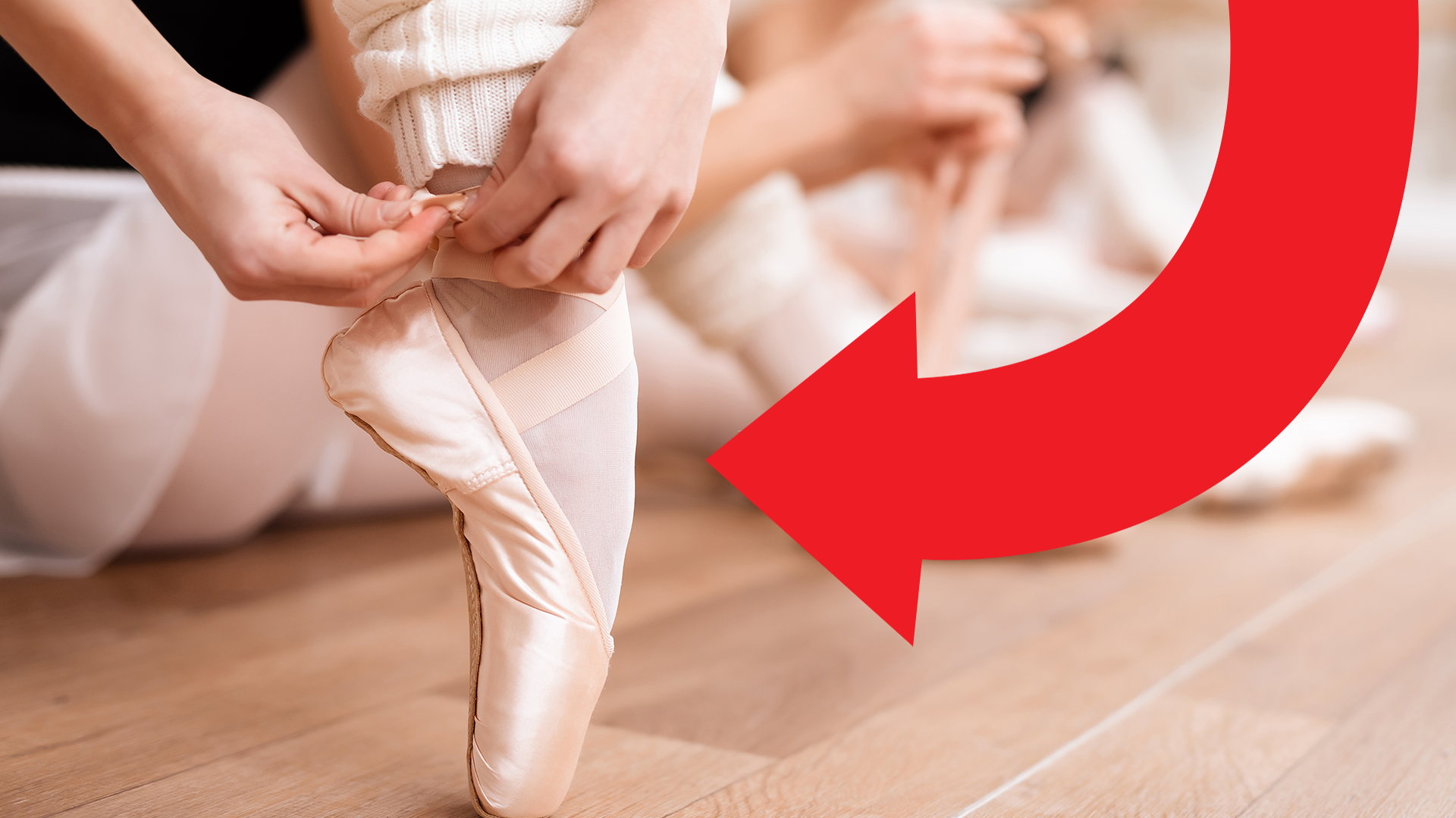 Ballerina doing up shoes with red arrow
