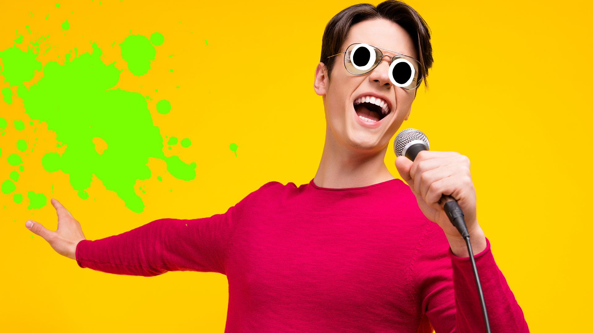 Man singing into mic on yellow background with green splat