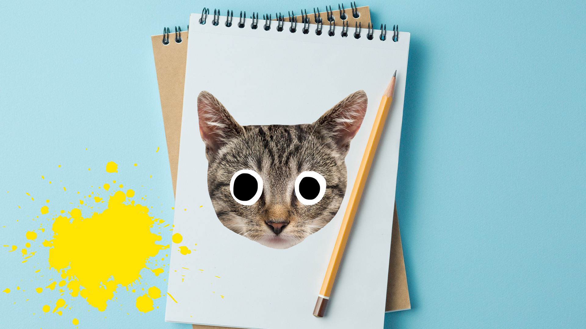Pad, pen and Beano cat on blue background with yellow splats