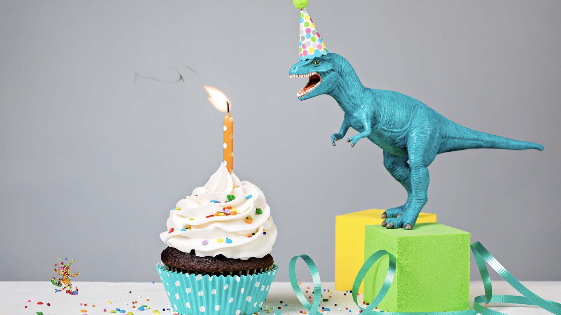 A flea celebrating its birthday with a cake and dinosaur