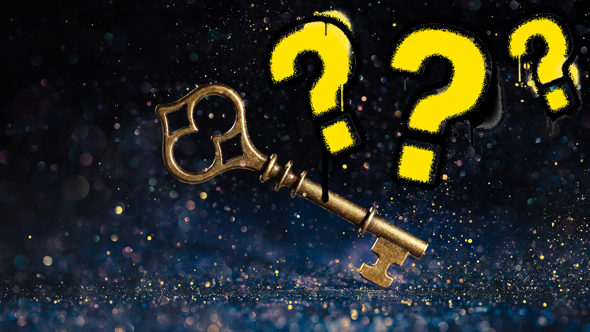 Key covered in sparkles with question marks