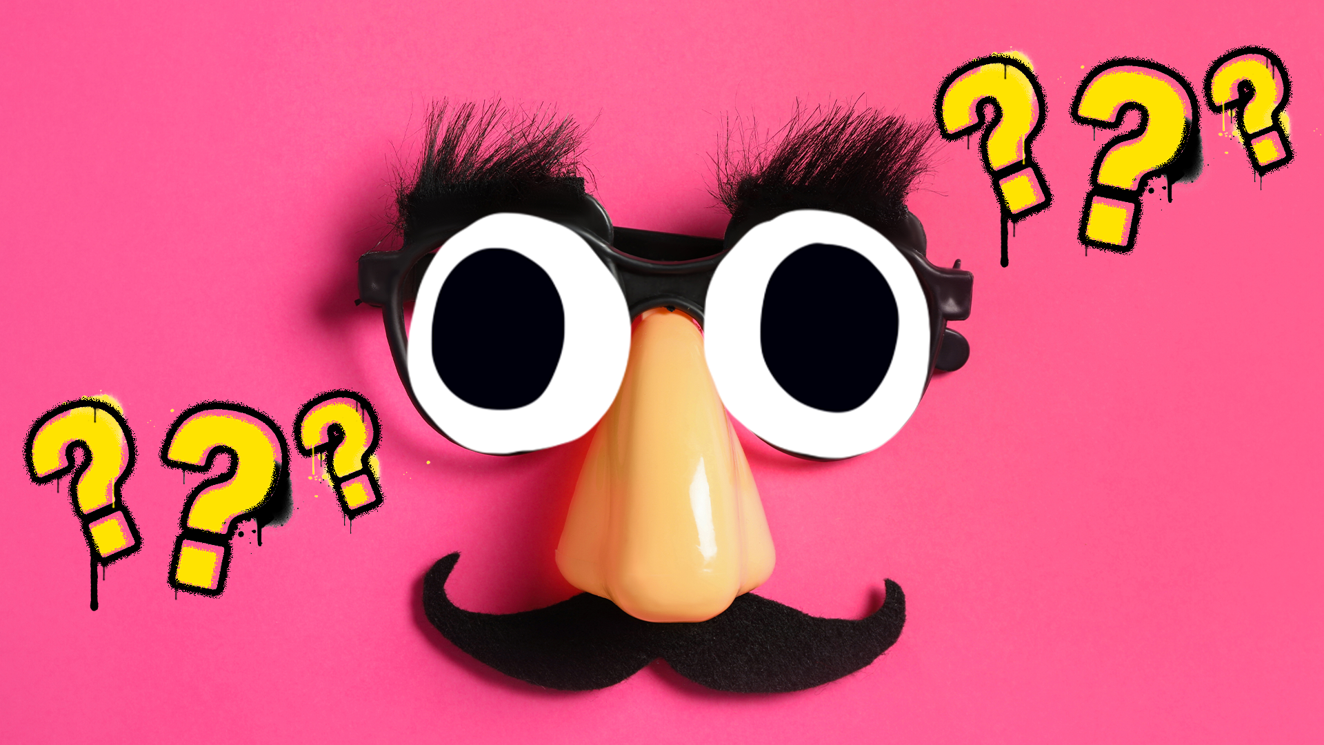 Comedy glasses on pink background with question marks