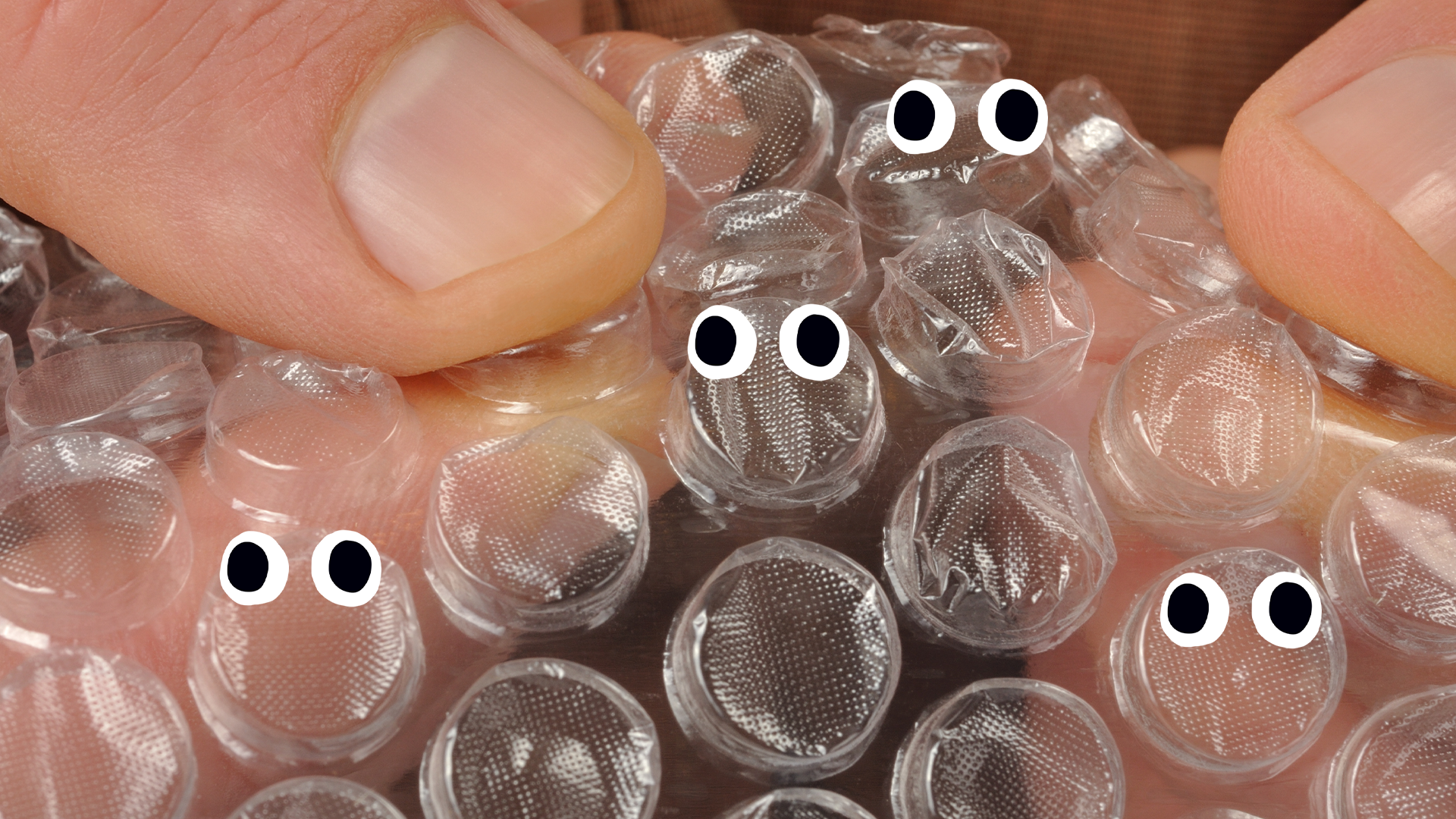 Fingers popping bubblewrap with eyes