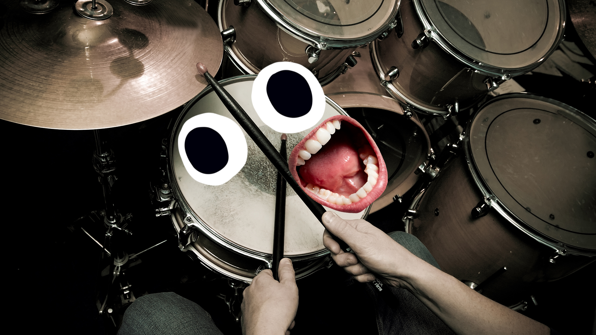 Someone playing drums with goofy face