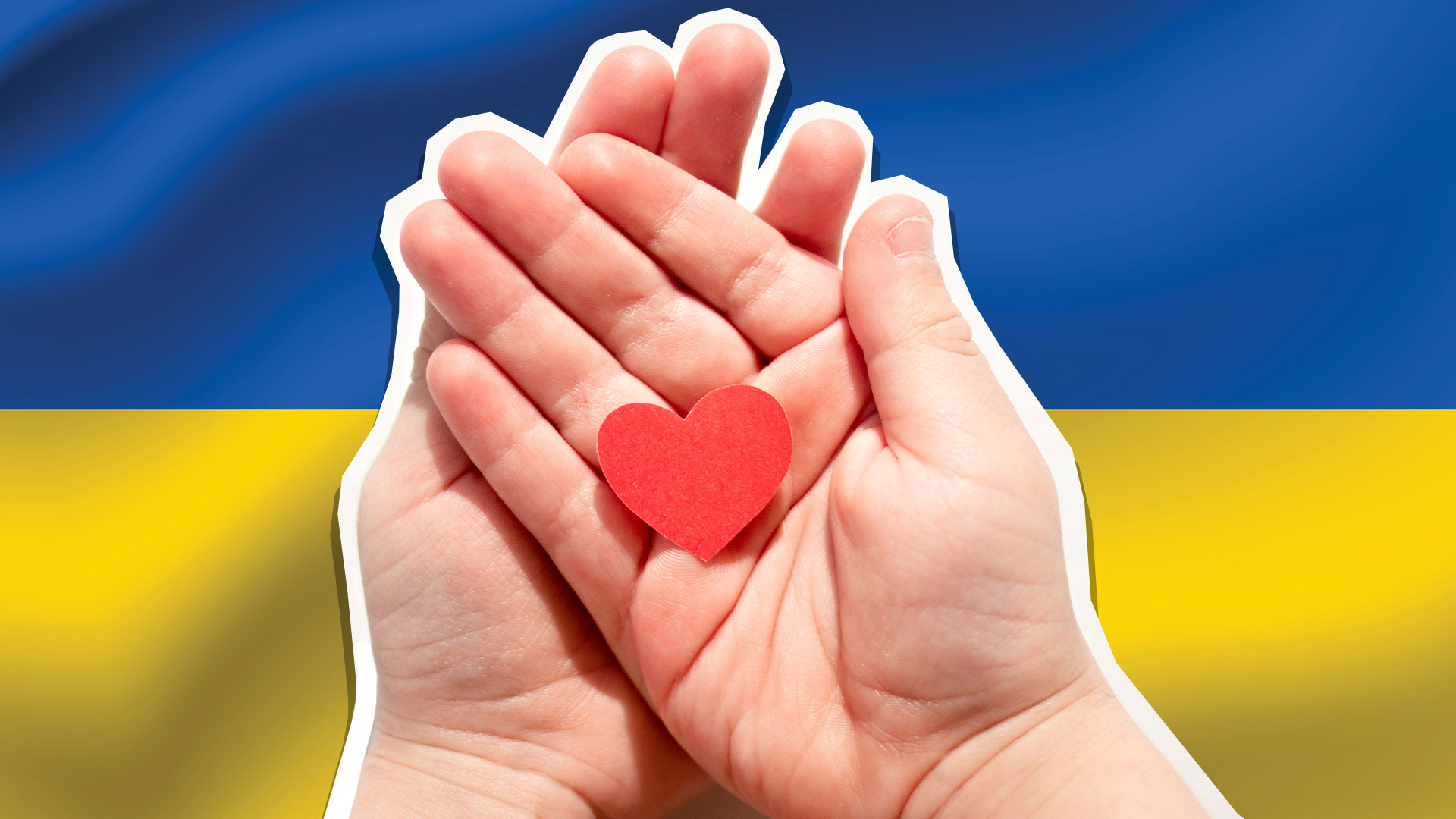 Hands holding a paper heart, with the Ukraine flag in the background