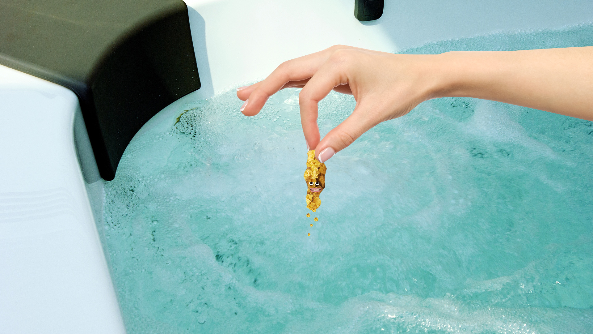 A hand crumbling a stock cube into a hot tub