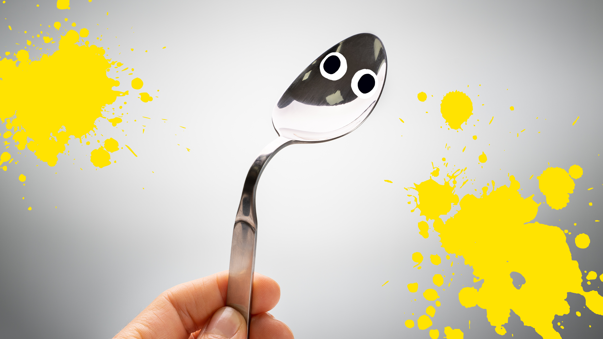 Bent spoon with eyes and splats